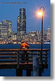 activities, america, buildings, cityscapes, couples, emotions, kissing, lamp posts, long exposure, nite, north america, pacific northwest, piers, romantic, seattle, structures, united states, vertical, washington, western usa, photograph