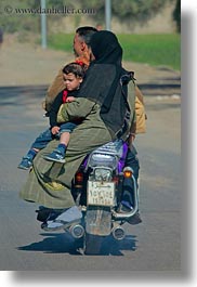 africa, burka, cairo, clothes, dresses, egypt, families, motorcyce, people, vertical, photograph
