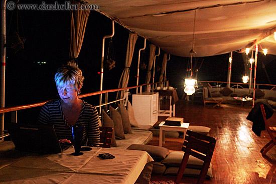 woman-using-laptop-on-ship.jpg