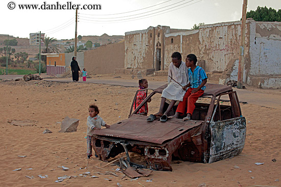 children-on-dilapitated-car.jpg