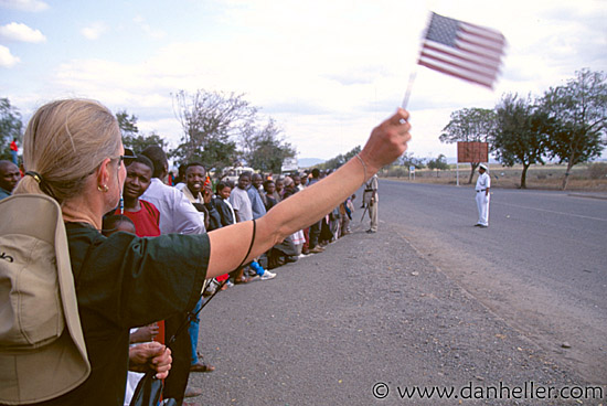 blond-woman-waiving-american-flag.jpg