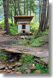 asia, bhutan, buildings, forests, houses, lush, nature, plants, trees, vertical, photograph