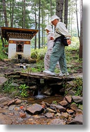 asia, bhutan, crossing, fulton, hikers, nancy, people, rivers, vertical, photograph