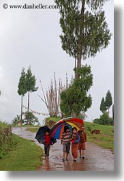 asia, asian, bhutan, childrens, clothes, costumes, emotions, people, smiles, style, umbrellas, vertical, photograph