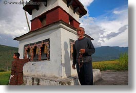 asia, asian, beards, bhutan, clouds, hair, horizontal, men, mustache, nature, people, prayers, senior citizen, sky, style, turning, wheels, photograph