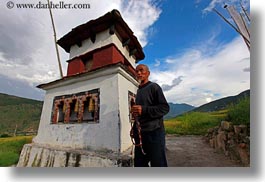 asia, asian, beards, bhutan, clouds, hair, horizontal, men, mustache, nature, people, prayers, senior citizen, sky, style, turning, wheels, photograph