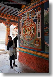 arts, asia, asian, bhutan, buddhist, clothes, interpreting, men, people, punakha dzong, religious, robes, temples, vertical, photograph
