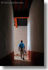 artists, asia, asian, bhutan, cameras, halls, men, people, photographers, punakha dzong, vertical, walking, photograph