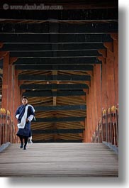 asia, asian, bhutan, bridge, buddhist, men, over, people, punakha dzong, religious, temples, vertical, walking, photograph