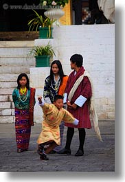 asia, asian, bhutan, bhutanese, buddhist, clothes, families, people, religious, robes, tashichho dzong, vertical, photograph