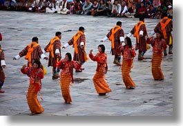 asia, asian, bhutan, buddhist, clothes, costumes, dancers, horizontal, oranges, people, religious, style, tashichho dzong, photograph