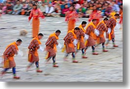 asia, asian, bhutan, buddhist, clothes, costumes, dancers, horizontal, oranges, people, religious, slow exposure, style, tashichho dzong, photograph
