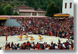 asia, asian, bhutan, buddhist, dancers, horizontal, people, religious, spinning, style, tashichho dzong, yellow, photograph