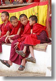 asia, asian, bhutan, boys, buddhist, clothes, colors, monks, people, red, religious, robes, style, vertical, wangduephodrang dzong, photograph