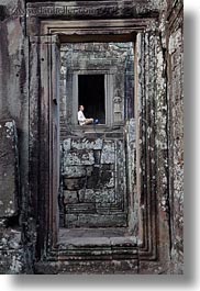 images/Asia/Cambodia/AngkorThom/Bayon/man-sitting-in-window.jpg