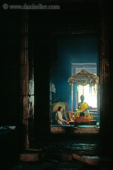 woman-lighting-candles-w-buddha.jpg
