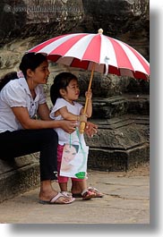 angkor wat, asia, cambodia, childrens, girls, people, red, striped, umbrellas, vertical, white, photograph