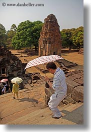 asia, bakong, cambodia, japanese, tourists, umbrellas, vertical, photograph
