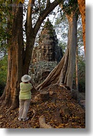 asia, cambodia, faces, gates, trees, vertical, victory, victory gate, womens, photograph