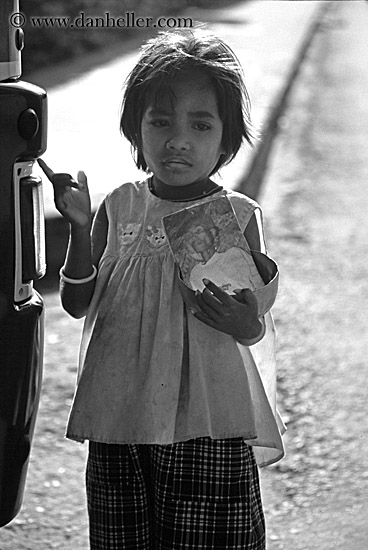 cambodian-girl-holding-photo-of-man-bw.jpg