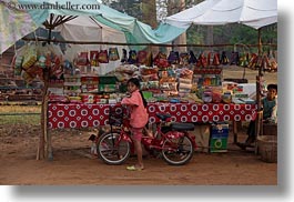 images/Asia/Cambodia/Transportation/girl-on-red-bike-by-market-stahl-1.jpg