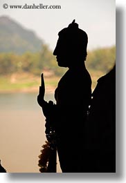 asia, buddhist, buildings, cave temple, laos, luang prabang, silhouettes, statues, temples, vertical, photograph