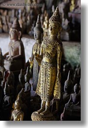 asia, buddhas, buildings, cave temple, caves, figurines, laos, luang prabang, temples, vertical, photograph