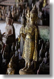 asia, buddhas, buildings, cave temple, caves, figurines, laos, luang prabang, temples, vertical, photograph