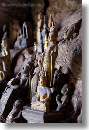 asia, buddhas, buildings, cave temple, caves, figurines, laos, luang prabang, temples, vertical, photograph