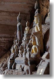 asia, buddhas, buildings, cave temple, caves, figurines, laos, luang prabang, temples, vertical, photograph