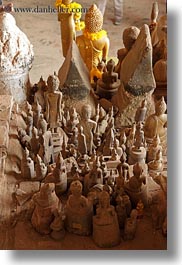 asia, buddhas, buildings, cave temple, caves, figurines, laos, luang prabang, temples, vertical, photograph