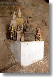 asia, buddhas, buildings, cave temple, caves, figurines, laos, luang prabang, temples, vertical, photograph