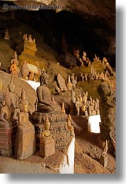 asia, buddhas, buildings, cave temple, caves, figurines, laos, luang prabang, temples, vertical, photograph