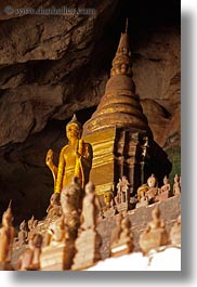 asia, buddhas, buildings, cave temple, caves, figurines, laos, luang prabang, temples, vertical, photograph