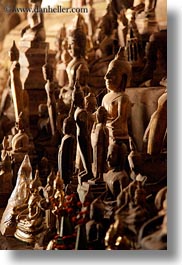 asia, buddhas, buildings, cave temple, caves, figurines, laos, luang prabang, temples, vertical, photograph