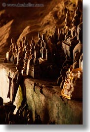 asia, buddhas, buildings, cave temple, caves, figurines, laos, luang prabang, temples, vertical, photograph