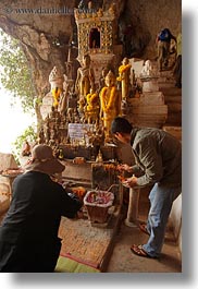 altar, asia, buildings, cave temple, laos, luang prabang, people, praying, temples, vertical, photograph
