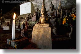 asia, buildings, candles, cave temple, glow, horizontal, laos, lights, luang prabang, statues, temples, photograph
