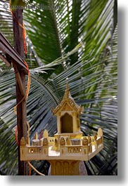 asia, buddhist, buildings, laos, luang prabang, models, nature, palm trees, plants, religious, small, temples, trees, vertical, photograph