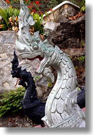 asia, buildings, dragons, heads, laos, luang prabang, phou si mountain, temples, vertical, photograph