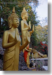 asia, buddhas, buildings, golden, laos, luang prabang, phou si mountain, statues, temples, vertical, photograph