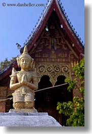 apsara, asia, buddhist, buildings, gold, laos, luang prabang, praying, religious, temples, vertical, wat sene, photograph