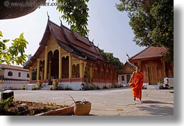 asia, buddhist, buildings, colors, horizontal, laos, luang prabang, monks, oranges, religious, temples, walking, wat sene, photograph