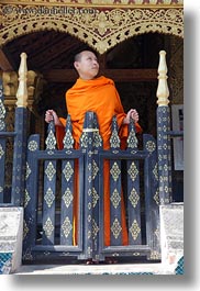 images/Asia/Laos/LuangPrabang/Buildings/Temples/Xiethong/Monk/monk-at-temple-gate-5.jpg
