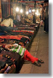 asia, bazaar, boys, down, laos, luang prabang, lying, market, vertical, photograph