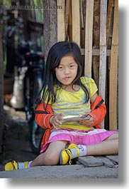 asia, asian, childrens, eating, girls, laos, luang prabang, people, vertical, yellow, photograph
