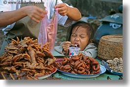 asia, childrens, eating, emotions, girls, horizontal, humor, laos, luang prabang, people, wince, wincing, yogurt, photograph