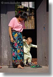 asia, babies, childrens, helping, laos, luang prabang, mothers, people, vertical, walk, photograph