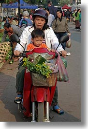 asia, childrens, clothes, flowers, hats, helmets, laos, luang prabang, mothers, motorcycles, nature, people, sons, vertical, photograph