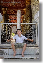 asia, asian, boys, childrens, emotions, gates, happy, laos, luang prabang, people, smiles, toddlers, vertical, photograph